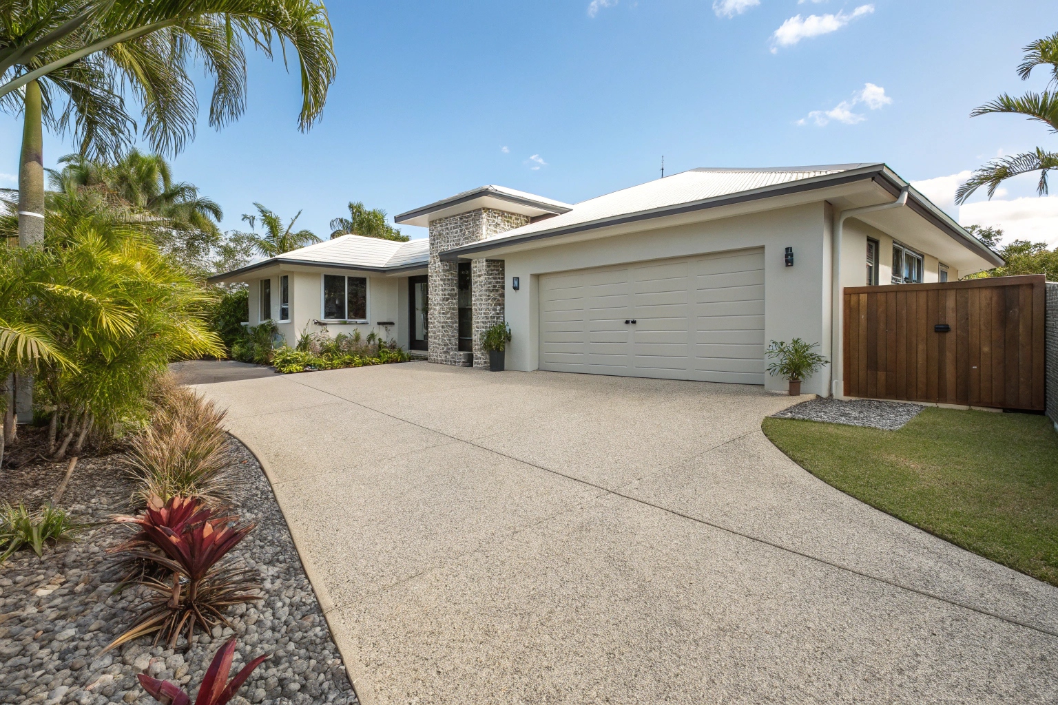 Exposed aggregate driveway installation at Townsville residential property
